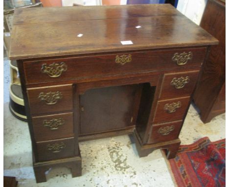 18th Century style oak ladies pedestal dressing table with recessed blind panel cupboard on bracket feet. (B.P. 24% incl. VAT