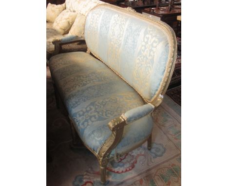 French style gilded and foliate upholstered three seater open arm sofa. (B.P. 24% incl. VAT)