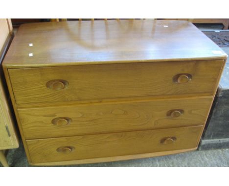 Elm Ercol straight fronted chest of three long drawers with blue Ercol label.(B.P. 24% incl. VAT)