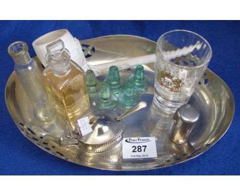 Silver plated cake dish with various items including: scent bottles, stoppers, silver plated mustard pot and large clay pipe.