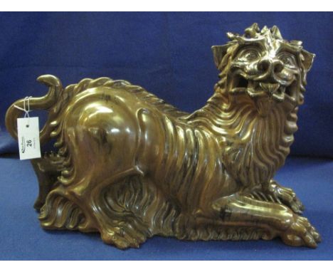 Large ceramic study of a Chinese Dog of Fo or Dragon Dog, brown and black streaked glaze with legible mark to base.  53cm lon