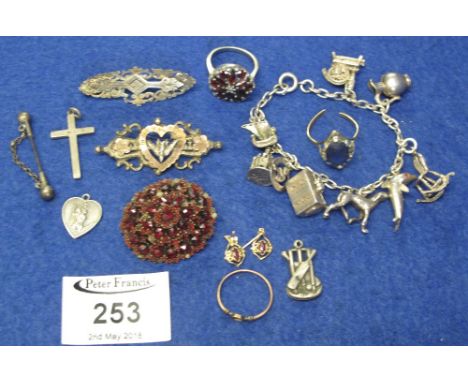 Collection of jewellery including: a Victorian bohemian garnet brooch, a garnet ring, silver charm bracelet etc. (B.P. 24% in