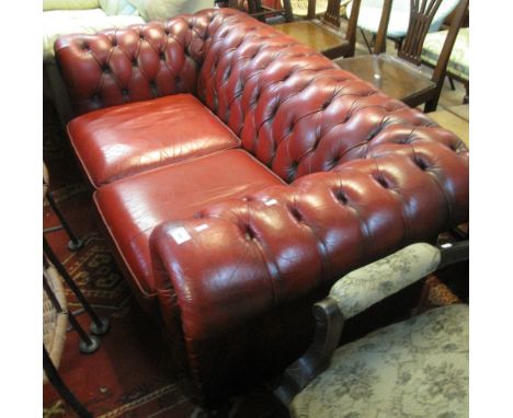 20th Century leather oxblood Chesterfield two seater sofa. (B.P. 24% incl. VAT)    CONDITION REPORT:  Wear with use as expect