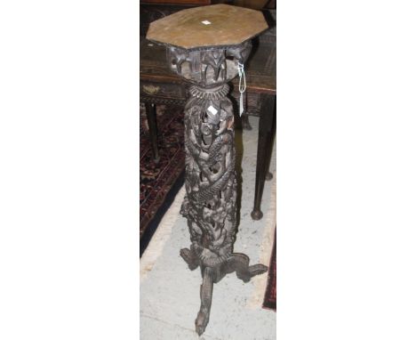 Indo-Chinese carved and pierced hardwood jardiniere stand with carved elephants and other decoration on tripod legs.(B.P. 24%