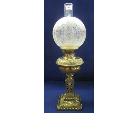 Early 20th Century brass double burner oil lamp with repousse brass half lobed reservoir on a pierced square section pedestal