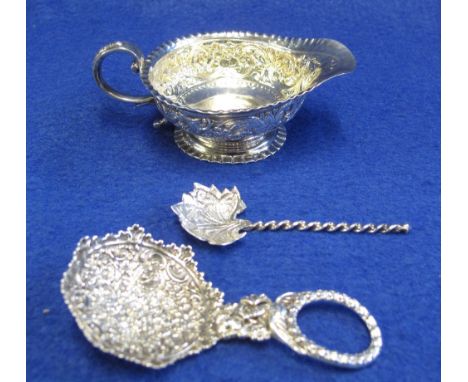 Victorian silver repousse decorated cream jug, London hallmark, metal leaf shaped spoon with twist stem and a repousse metal 