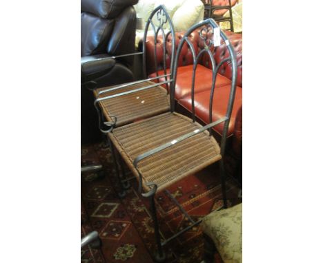 Pair of modern wrought iron arch top gothic design conservatory armchairs with wicker seats. (2)(B.P. 24% incl. VAT) 