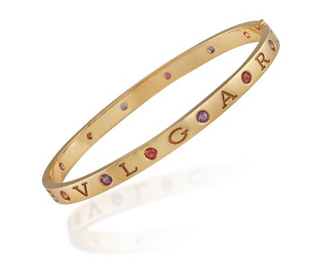 A GEM-SET 'BVLGARI BVLGARI' BANGLE, BY BULGARIThe polished rose gold hinged bangle with 'Bvlgari' engraving highlighted with 