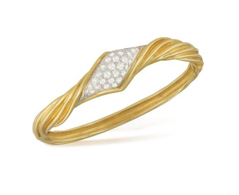 A DIAMOND BANGLE, BY FRED PARISThe hinged bracelet pavé-set with brilliant-cut diamonds to the front, with twisted fluted det