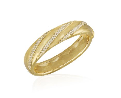 A DIAMOND BANGLE, BY DAVID MORRIS, CIRCA 1985The frontispiece set with three bands pavé-set with brilliant-cut diamonds, with