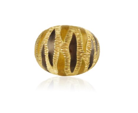AN ENAMEL RING, BY FRED PARIS, CIRCA 1965Of bombé design, The brown and yellow enamel stripes on textured gold mount, mounted