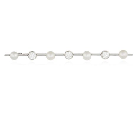 A NATURAL PEARL AND DIAMOND BROOCH, FRENCHThe knife-edge bar set with three old European-cut diamonds between button-shaped n