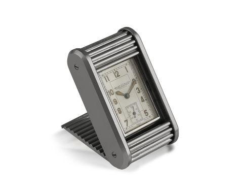 A MANUAL WIND TRAVEL CLOCK, BY JAEGER-LECOULTRE, CIRCA 1950Of manual wind movement, silvered dial with luminous filled Arabic