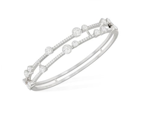 A DIAMOND 'WATERFALL' BANGLE, BY BOODLES, 2006The hinged bracelet set with two rows pavé-set with brilliant-cut diamonds, wit