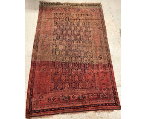 A vintage Afshar carpet, the central panel set with all over hook design on a blue ground within a stepped red, blue and crea