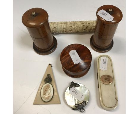 A 19th Century Chinese carved bone bodkin case, 15.5 cm long, a 19th Century mother of pearl and white metal mounted magnifyi