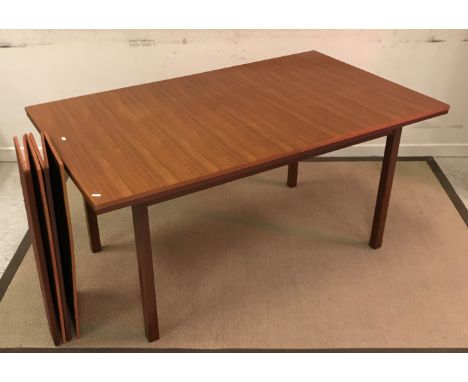 A modern teak rectangular dining table of plain form, 154.5 cm wide x 91.5 cm deep x 74 cm high, a set of eight similar oak s