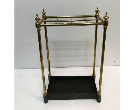 A brass and cast iron eight section stick stand of plain rectangular form 63 cm high x 23 cm deep x 40 cm wide CONDITION REPO