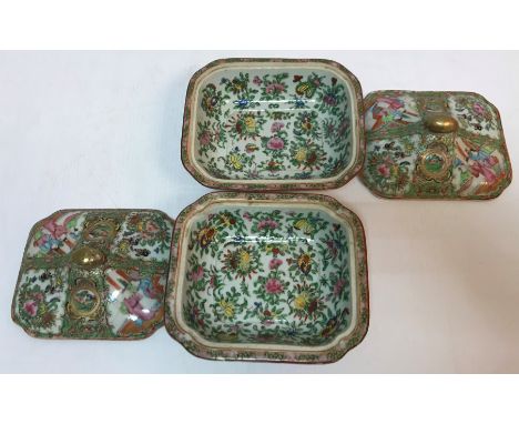 A pair of 19th Century Chinese famille rose tureens and covers of small proportions each decorated with panels of figures in 