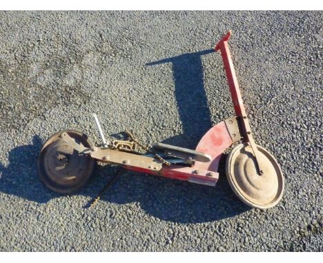 OLD RED SCOOTER , WOODEN HANDLES, METAL WHEELS WITH CHAIN, BELIEVED TO BE AN EARLY HARRODS SCOOTER, SOME RESTORATION REQUIRED