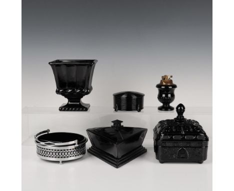 A set that includes a circular lidded bowl with engraved rings, a bee and beehive engraved lidded bowl, a triangular lidded b