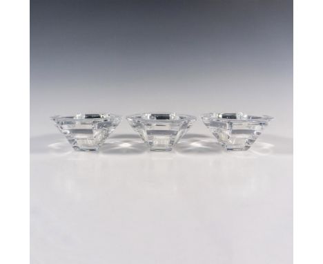 A set of 3 double-handled votive candle holders. Clear and smooth. Nambe etched markings. This item has its original box: 13"