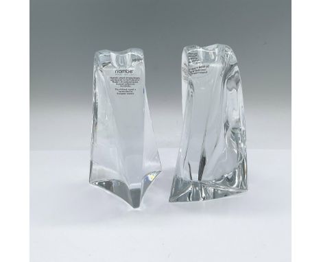 A set of 2 full-lead crystal tall candleholders in a curved abstract form. Nambe sticker and engraved marking. This item has 