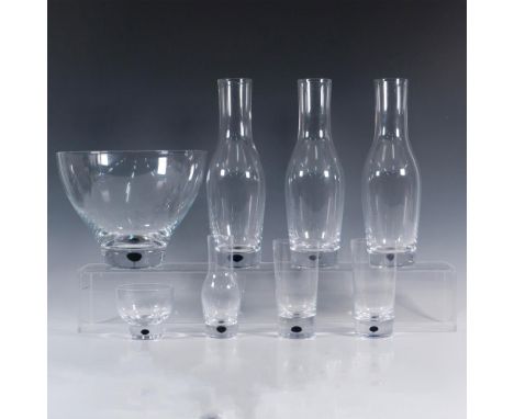 Two tall glasses that measure approximately 3"dia. x 6"H. Three large carafe pitchers that measure approximately 3.75"dia. x 