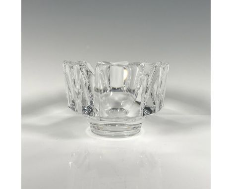 Clear with a round base and six rectangular faces, each separated by a V-shaped gap. Orrefors backstamp. This item has its or