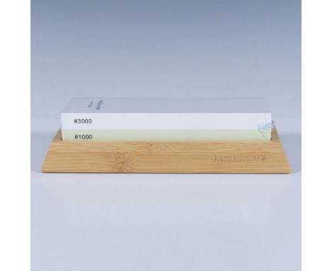 1000 grit and 3000 grit sides, and a bamboo display stand. This item has a base included: 8.25"L x 3.5"W x 1"H. Whetstone: 7"