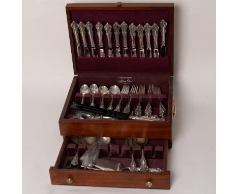 Ornate handle with scrolled floral design creates a stunning flatware set. Housed in wooden, felt lined box with lower drawer