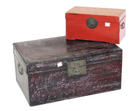 A Chinese hardwood trunk, 34cm high, 73cm wide, 46.5cm deep, together with a red lacquer box, 22cm high, 42.5cm wide, 23.5cm 