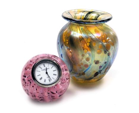 An Allen Bay iridescent amber glass vase, 10cm high, together with a Caithness Whispers clock paperweight. (2)