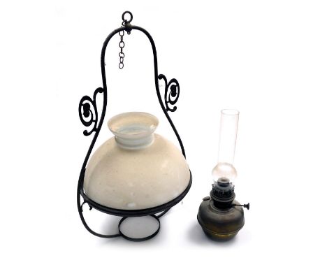 An early 20thC Art Nouveau style Veritas brass hanging oil lamp, with a glass chimney and white glass shade, 78cm high. 
