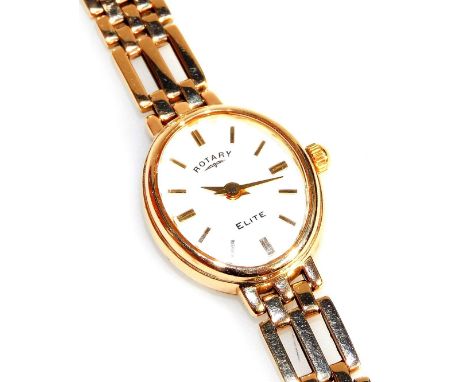 A Rotary Elite lady's 9ct gold cased wristwatch, oval white dial bearing gold batons, on a 9ct gold gate bracelet, boxed, wit
