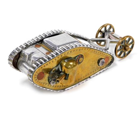 A WWI trench art model of a British Mk 1 tank, with moveable side guns, and rear wheels, 14.5cm wide.