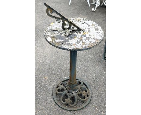 A Victorian cast iron sundial, raised on an octagonal column over a pierced circular base, 81cm high.