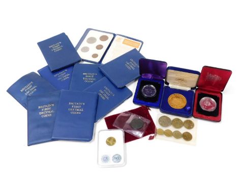 Nine sets of The Britain's First Decimal coins, Canadian dollar 1975, a Polish Kuzinica, further commemorative coins, and a G