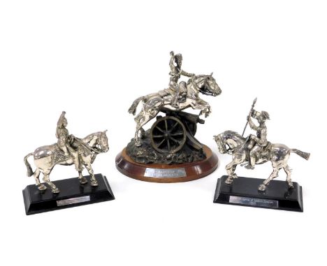 A pair of pewter military figures, mounted on horseback, raised on a wooden base, comprising the Blues &amp; Royals, and 21st