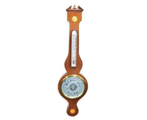 A Georgian style mahogany cased wheel barometer by Rapport of London, with central dial beneath a thermometer, the case with 