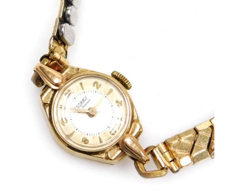 A Rotary lady's 9ct gold cased wristwatch, the circular silvered dial with champagne chapter ring bearing Arabic numerals at 