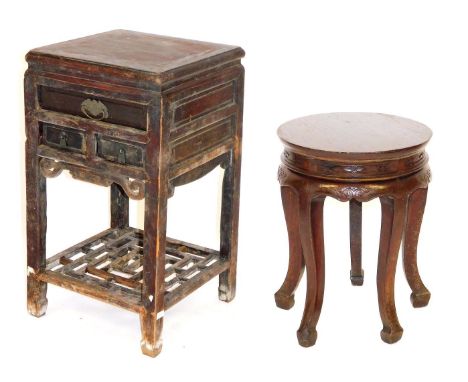 A Chinese hardwood urn table, of square section, with one long and two short drawers, raised on square legs united by a carve