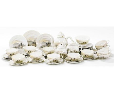 A 20thC Japanese eggshell porcelain part tea service, decorated with buildings before Mount Fuji, comprising twelve tea cups,