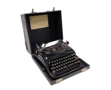 A Remington portable typewriter, no. W365634, cased.