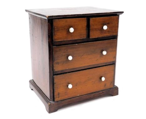 A Victorian pine apprentice chest, of two short over two long drawers, raised on bracket feet, 29.5cm high, 26cm wide, 20.5cm