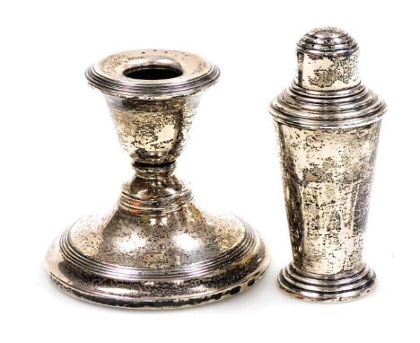 A George VI silver pepperette, of cocktail shaker form, Birmingham 1943, 1.58oz, together with a loaded silver squat candlest
