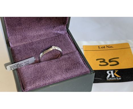 18ct white gold ring with modern set 0.10ct central diamond.  RRP £1,254We have used a ring sizer mandrel to determine the in