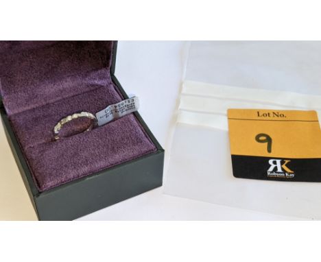 18ct white gold &amp; diamond ring with 0.32ct of diamonds (8 diamonds in 2 pairs). RRP £1,854We have used a ring sizer mandr