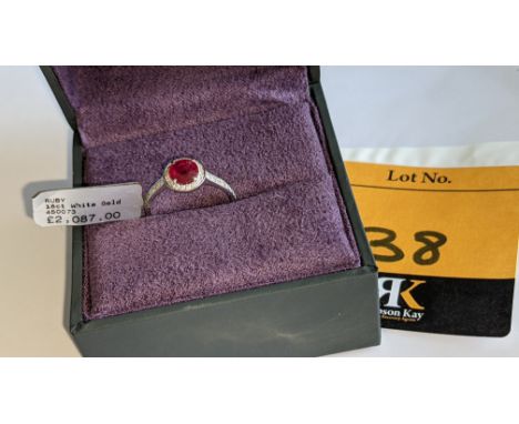 18ct white gold ring with central ruby &amp; 0.27ct diamonds around the ruby &amp; on each shoulder.  RRP £2,087We have used 