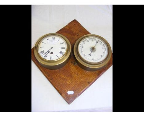An old ship's clock and barometer by Pascall Atkey & Son of Cowes CONDITION REPORTEnamel dial chipped/cracked near clock wind